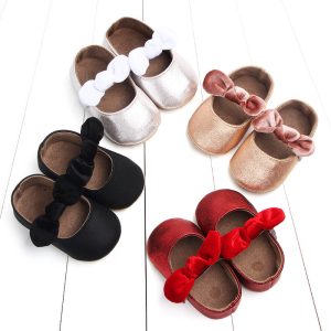 Soft baby shoes with satin finishes and matching bows available in white, black, pink, and red, perfect for special occasions or everyday wear. Stylish, comfortable, and ideal for infants.
