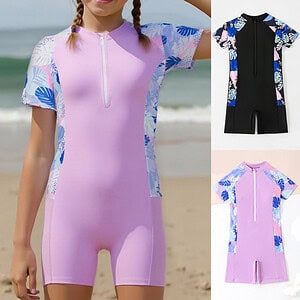 Girls' short sleeve swim suit in pink with floral patterned sleeves and a front zipper.