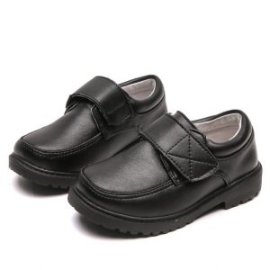 Comfortable black leather kids' loafers with Velcro straps, ideal for school and casual wear. Durable, stylish, and easy to put on, perfect for children's daily activities.