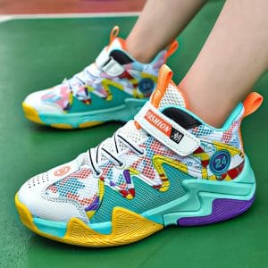 Bright colorful athletic sneakers with vibrant pattern designs perfect for sports or casual wear on a green court.