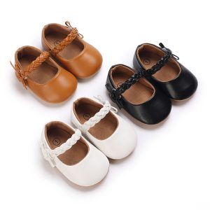 Set of children's leather Mary Jane shoes in brown, black, and white with braided details.