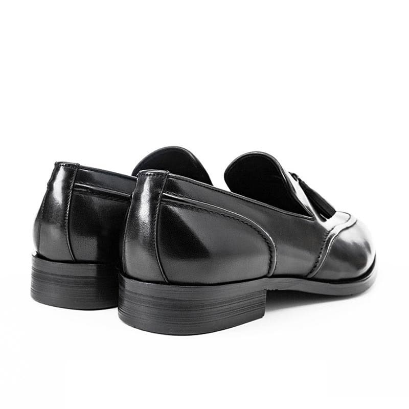 Timeless Elegance: Stylish Tassel Leather Shoes for Today's Gentleman 8 Polished Black Leather Dress Shoes On White Background, Stylish Formal Footwear For Men And Women. Perfect For Workplace, Business Meetings, And Special Occasions. Quality Craftsmanship And Elegant Design.