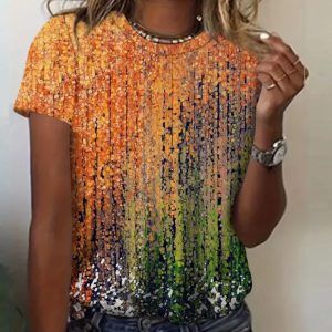 Short sleeve t-shirt featuring a multicolored design with orange, green, and black patterns.