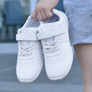Comfortable white children's sneakers with velcro strap, perfect for casual wear and outdoor activities.
