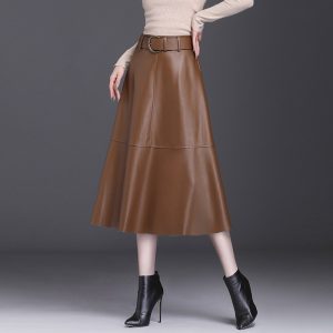 Brown leather midi skirt featuring a belt and a flared design worn by a model.