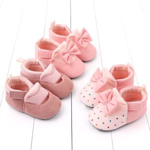 Pink baby shoes with bow and polka dots for infant girl footwear, soft soles, adorable toddler sneakers, cute kids' shoes for special occasions and daily wear, comfortable and stylish baby footwear for girls.