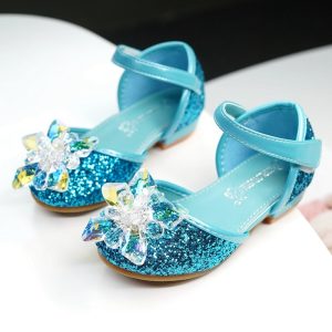 Sparkly blue children's dress shoes with rhinestone embellishments and ankle straps, perfect for special occasions and trendy kids' footwear.