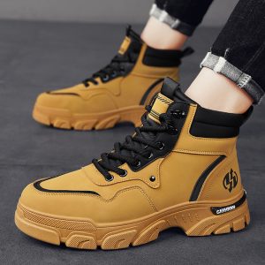 Yellow and black tactical work boots with durable rubber soles, designed for safety and comfort, perfect for industrial or outdoor activities.