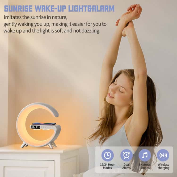 Versatile Bluetooth Speaker with Charger & Alarm Clock - Your Ultimate Companion 7 Sunrise Wake-Up Light Alarm Clock With A Woman Stretching Beside It In A Softly Lit Room.