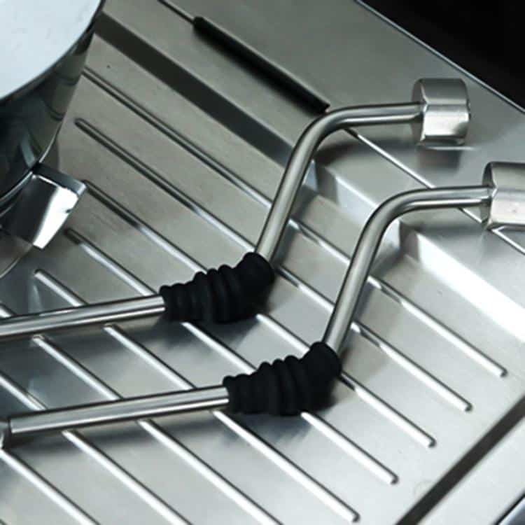 Silicone Coffee Steam Pipe Cover - Protect Your Machine with Style! 4 Two Stainless Steel Cooking Utensils With Rubber Grips Resting On A Metal Surface.