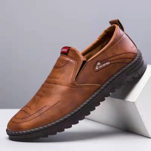 Pair of men's brown leather casual shoes on display.