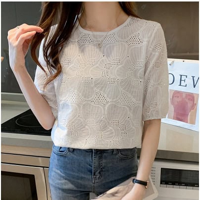 Fashion-forward: Women's Chic Embroidered Chiffon Shirt - Stylish & Breathable 2 Woman Wearing A White Top With A Floral Pattern And Short Sleeves, Standing In A Kitchen.