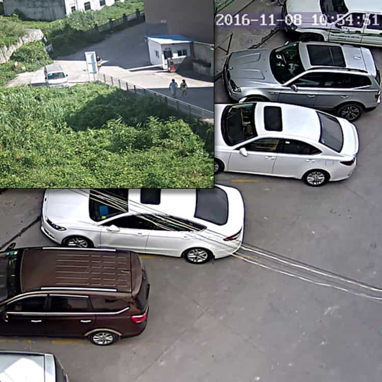 High-Performance Waterproof AHD Camera with Night Vision & White Balance 10 White And Brown Suvs Parked In A Lot With Cable Wires Connected To The White Suv, Close-Up View Of Modern Parking Area With Surveillance, Showcasing Vehicle Security At Syndmart.