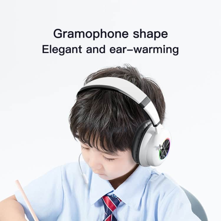 Foldable Wireless Headset with Mic - T&G KE-29 | Clear Sound, Comfort Fit 6 A Child Wearing Gramophone-Shaped Headphones While Writing With A Pencil.