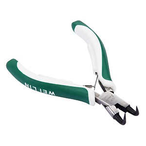 Surgical staple remover, medical instrument for healthcare professionals, stainless steel tool with green and white handle for easy grip, used for removing stainless steel staples in medical settings, durable and ergonomic design for precision and comfort.
