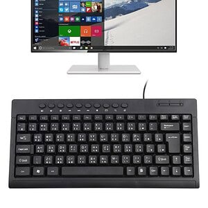 Keyboard with computer monitor displaying Windows interface and apps, ergonomic desktop setup, technology, office equipment, productivity tools, sleek design, modern workspace, syndmart.