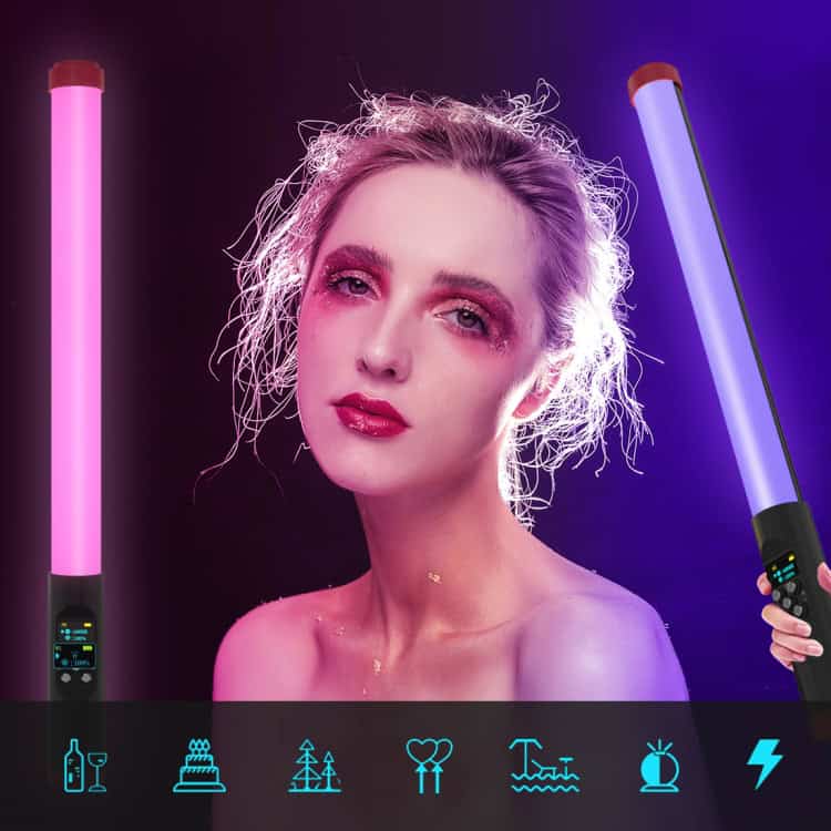 PULUZ RGB 114 LEDs Waterproof Photography Handheld Light Stick • Remote Control 8 A Model Posing With A Colorful Led Light Stick In Pink And Purple Hues Against A Dark Background.