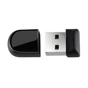 USB flash drive with black cap isolated on white background, portable data storage device.