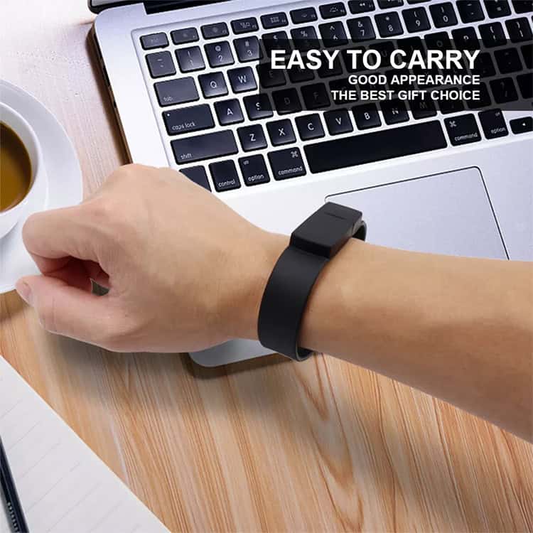 16GB Green Silicon Bracelets USB 2.0 Flash Drive - Portable & Stylish Storage 7 Black Fitness Tracker Worn On A Wrist Next To A Laptop And Coffee Cup.