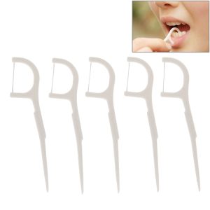 Set of five white dental floss picks designed for oral hygiene use.