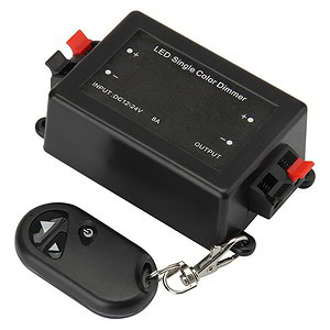 Small black LED single color dimmer switch with remote control for lighting adjustment.