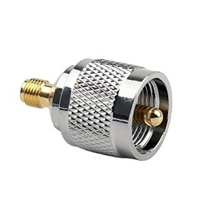 RF coaxial connector with gold-plated pin and knurled metal body for reliable signal transmission.