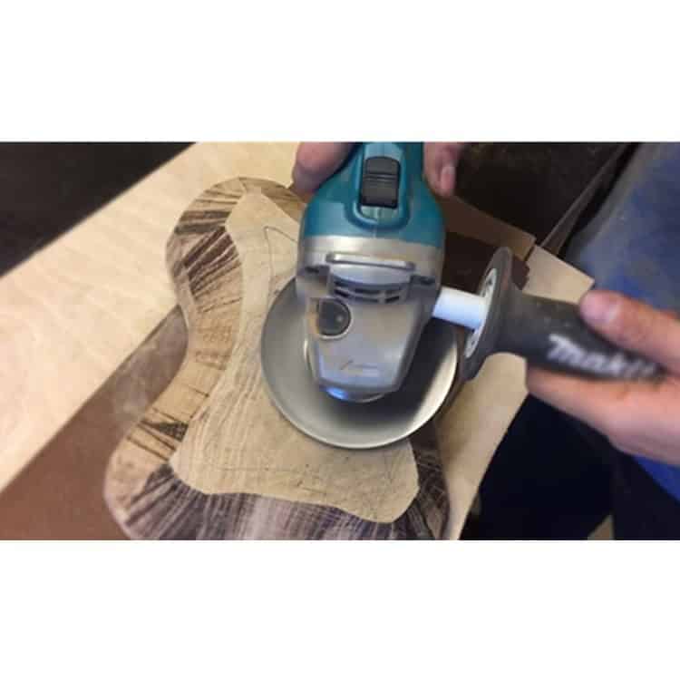 Woodworking Sanding Thorn Disk for Angle Grinder - Polishing & Grinding Accessories 6 Handheld Electric Sander Smoothing A Wooden Sculpture In Woodworking Workshop, Promoting Professional Carpentry Tools And Techniques.