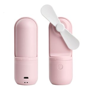 Portable mini fan in pink color with a foldable design and USB charging port.