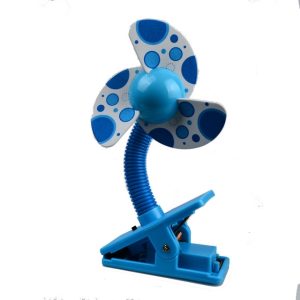 Clip-on fan with a blue base and polka dot patterned blades in blue and white.