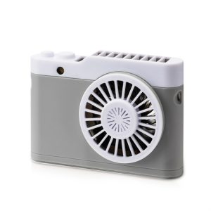 Compact portable fan with a USB charging port and a circular fan design.
