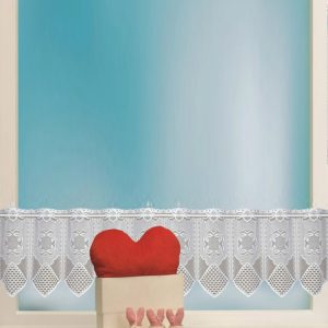 Heart-shaped cushion on windowsill with lace curtain behind, cozy home decor, charming window scene, Syndmart home accessories, decorative cushions for living room and bedroom.