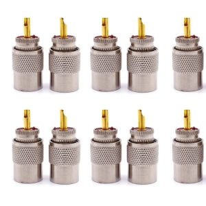 Gold-plated RCA audio connectors with knurled metal housing, used for high-quality audio and speaker connections. Perfect for professional audio, home theater systems, and audio equipment setups.
