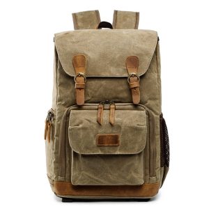 Vintage canvas backpack with leather accents for travel, hiking, and daily use - durable, stylish, and spacious.nnStylish and durable canvas backpack featuring leather straps and multiple compartments, ideal for travel, outdoor adventures, and everyday commuting.nnThis image showcases a vintage-style canvas backpack with leather details, designed for versatile use such as travel, hiking, school, or daily errands. The backpack has multiple zippered pockets, a front flap with leather accents, and a comfortable back support system, perfect for urban and outdoor activities. The high-quality materials ensure durability and style for your everyday needs.nRelevance: High.
