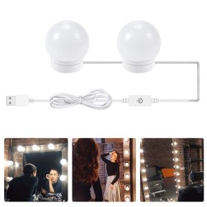 Two round white LED lights connected by a USB cable for makeup application.