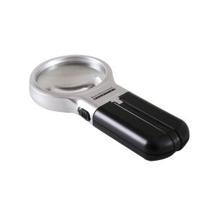 A handheld magnifying glass with a silver frame and black handle for close-up viewing.