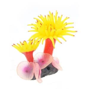 Artificial yellow and red flower decoration with pink accents and a black base.