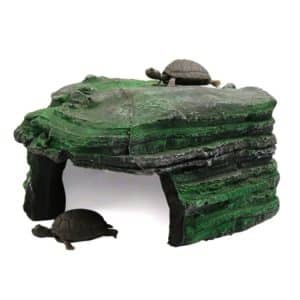 Artificial rock habitat for turtles with two turtle figures on top and one underneath.
