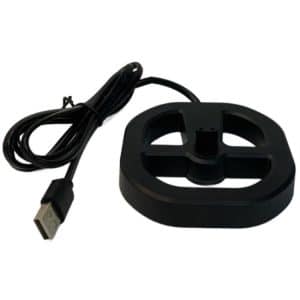 Black circular USB charging dock with a cable attached for electronic devices.