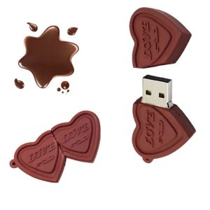 Melting chocolate heart-shaped USB flash drive with "LOVE" engraving, broken and spilled chocolate pieces, ideal for romantic gift or tech accessories, high-quality, creative design.