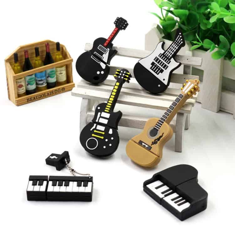 Innovative 4GB USB 2.0 Triangle Guitar U Disk - For Music Enthusiasts 8 Colorful Toy Guitars And Musical Instruments For Children, Including A Piano And Keyboard, Displayed With A Small Wooden Crate Of Miniature Wine Bottles, Perfect For Kids' Play And Music Learning.