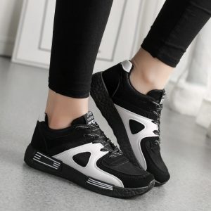 Black and white sporty sneakers for women, casual athletic shoes, stylish footwear for running and walking, comfortable designer sneakers for everyday wear, trendy sports shoes for active lifestyle.