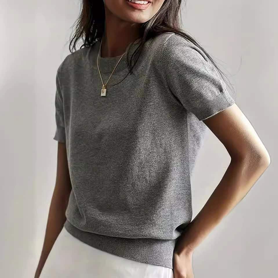Solid Color French Short Sleeve Sweater - Simple Round Neck Charm 4 Woman Wearing A Gray Short-Sleeve Sweater With A Round Neckline And A Necklace.