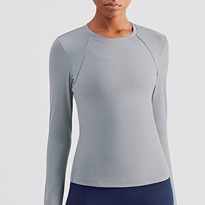 Bold, sleek gray long-sleeve athletic shirt for women suitable for running, training, or casual wear, made with moisture-wicking fabric for comfort.