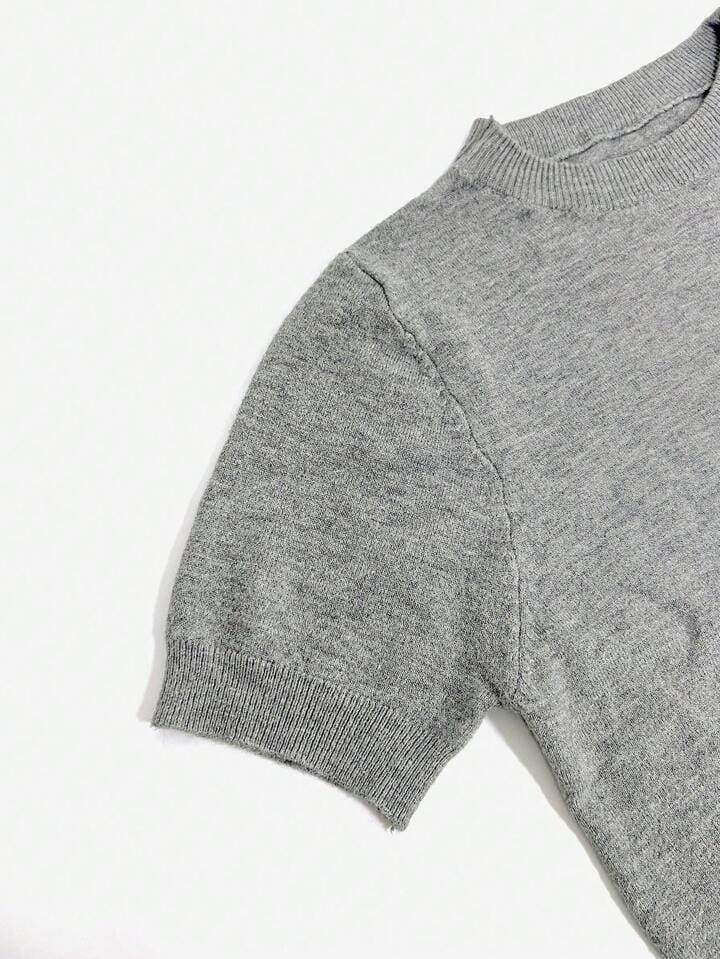 Solid Color French Short Sleeve Sweater - Simple Round Neck Charm 10 Gray Short-Sleeve Sweater With A Round Neckline And Ribbed Cuffs Laid Flat On A White Background.