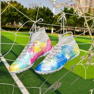 Colorful athletic shoes with graffiti-style design hanging on a soccer net, showcasing trendy sportswear for active lifestyles and sports enthusiasts, perfect for sportswear and footwear SEO.