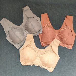 Silk Lace Bras In Grey, Peach, And Blush Colors, Displayed On A Dark Fabric Background, Showcasing Luxurious Lingerie Designs And Detailing For Women’s Fashion And Comfort Needs.