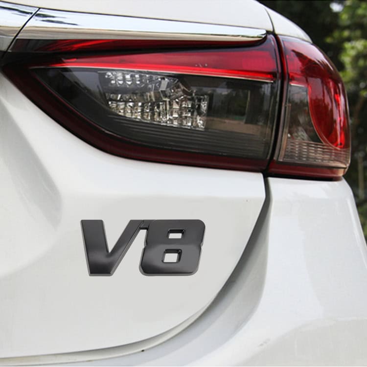 V8 Connect Shape Small Car Metal Sticker for Stylish Body Decor 5 V8 Engine Badge On A White Car Rear, Close-Up Of Vehicle Performance Emblem, Rear Tail Light, Automotive Parts, Luxury Car Design, Syndmart Automotive Accessories.