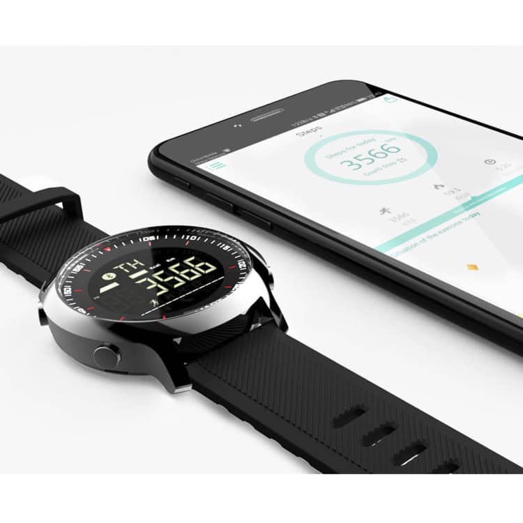 Lokmat MK18 Waterproof Smart Watch - Health Monitoring, IP68 Rated 11 Fitness Smartwatch Displaying Digital Time And Heart Rate On A Sleek Black Strap With A Mobile App Interface On A Smartphone Screen.