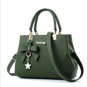 Elegant green leather handbag with bow and butterfly charm, perfect for fashion-forward accessories, luxury bags, and stylish women's handbags. High-quality, trendy, and versatile for everyday use.