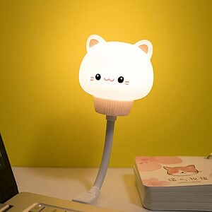 Cute cat-shaped LED desk lamp with a adorable kawaii design, perfect for bedroom or study decor, energy-efficient and adjustable lighting for cozy ambiance.